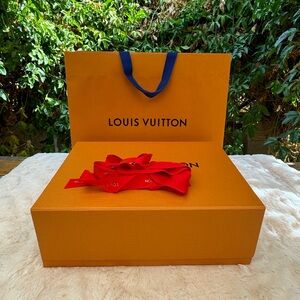 Louis Vuitton box, shopping bag and ribbon.